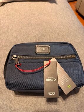 Tumi Alpha Bravo Navy Toiletry Kit with Red Zip Pull
